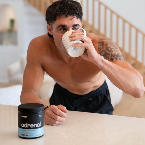 switch nutrition adrenal switch powder male drinking in kitchen