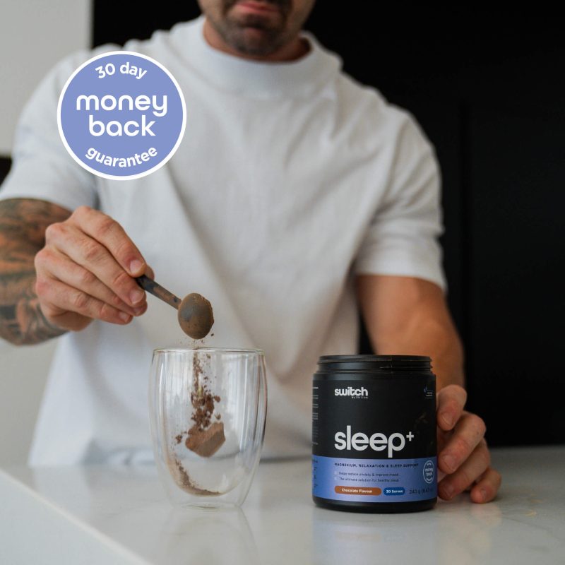 switch nutrition man scooping sleep chocolate powder into mug 30 day money back guarantee